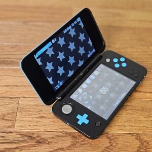 Black and Blue Handheld Gaming Console